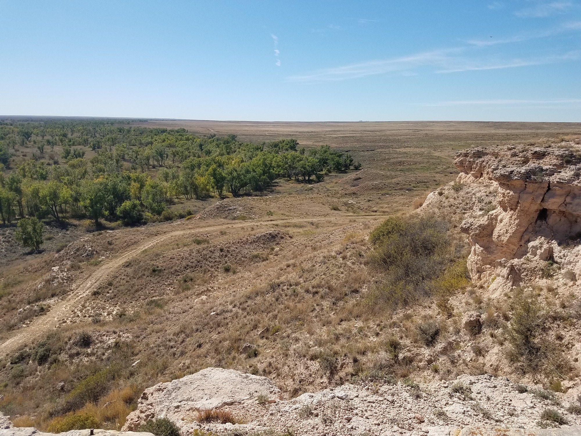 A view from the top of a cliff, overlooking the plains.