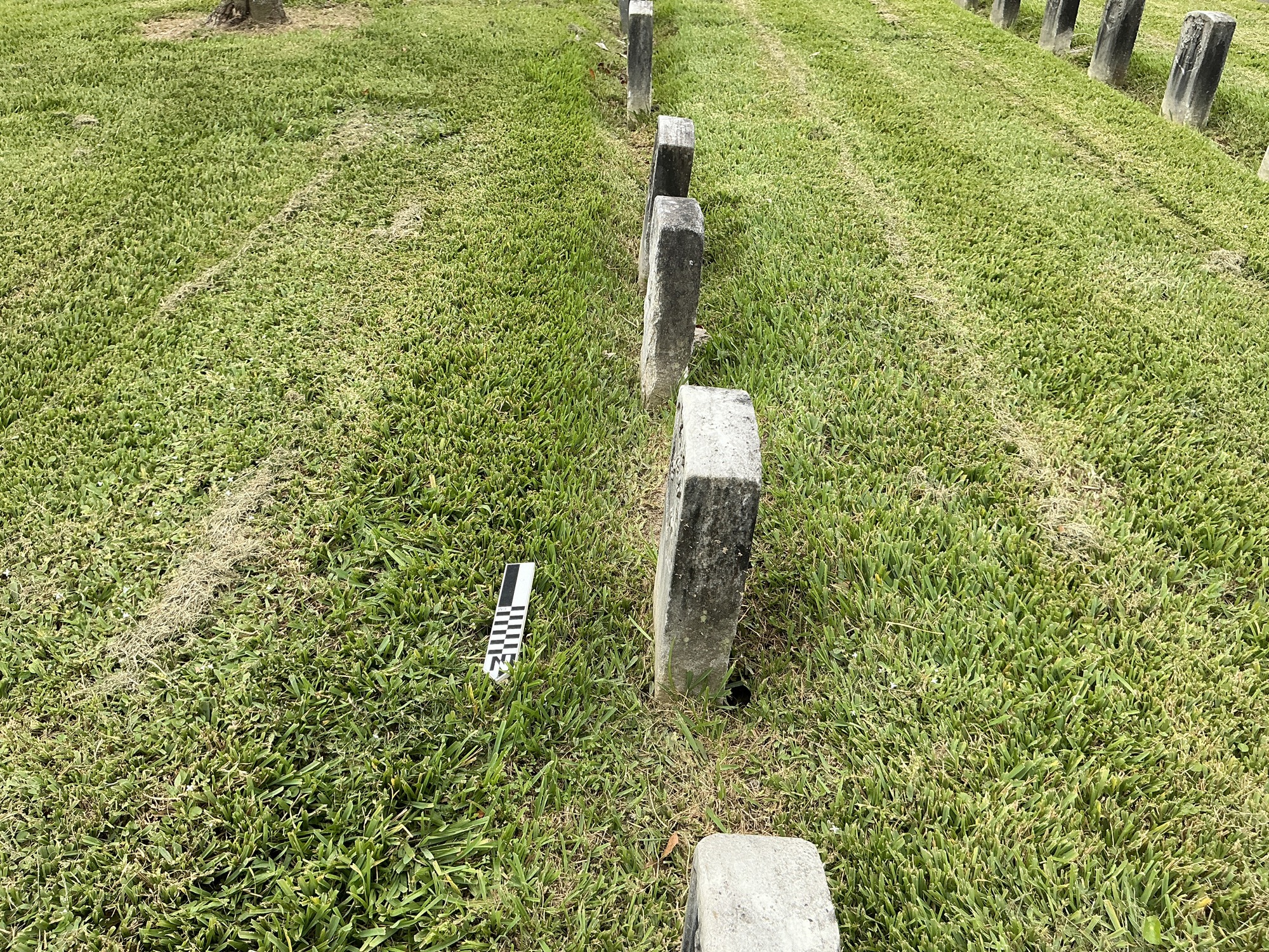 Extra image of historic upright marble headstone with recessed shield face.