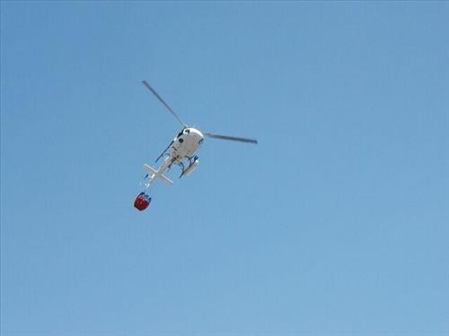 A White Firefighting Helicopter Uses Water to Suppress the Fires, Long Mesa Fire, Mesa Verde National Park, July-August 2002