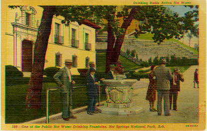 Unused postcard.  Watercolor view of public drinking fountain, caption reads, "Drinking Radio Active Hot Water."