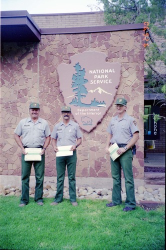 Color Photos of Superintendent Harold Grafe giving out awards to park personnel.