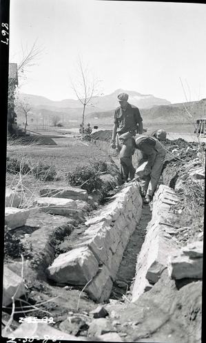 Construction of irrigation ditches in front of cafeteria, Camp Center, South Entrance.