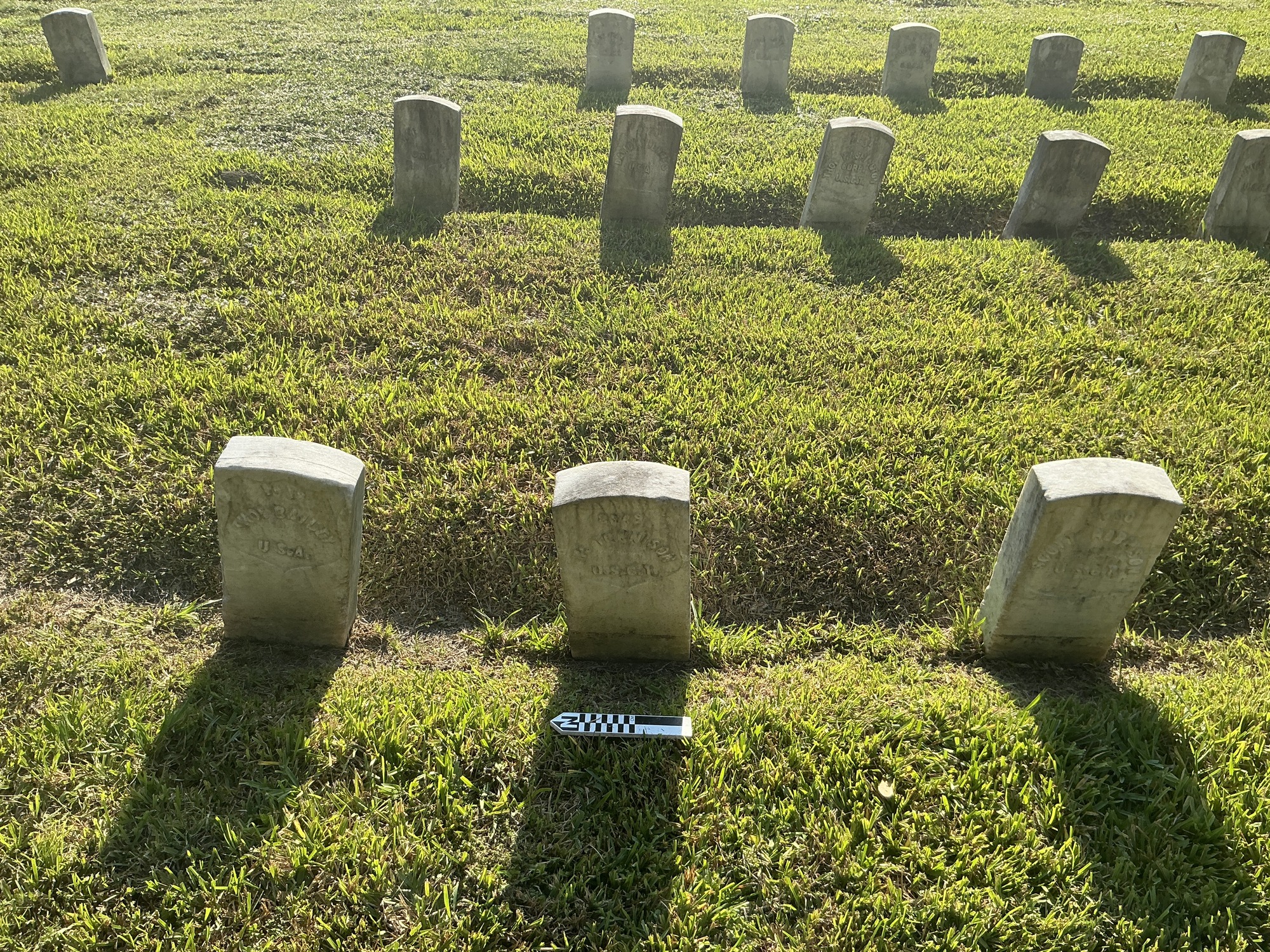 Extra image of historic upright marble headstone with recessed shield face.