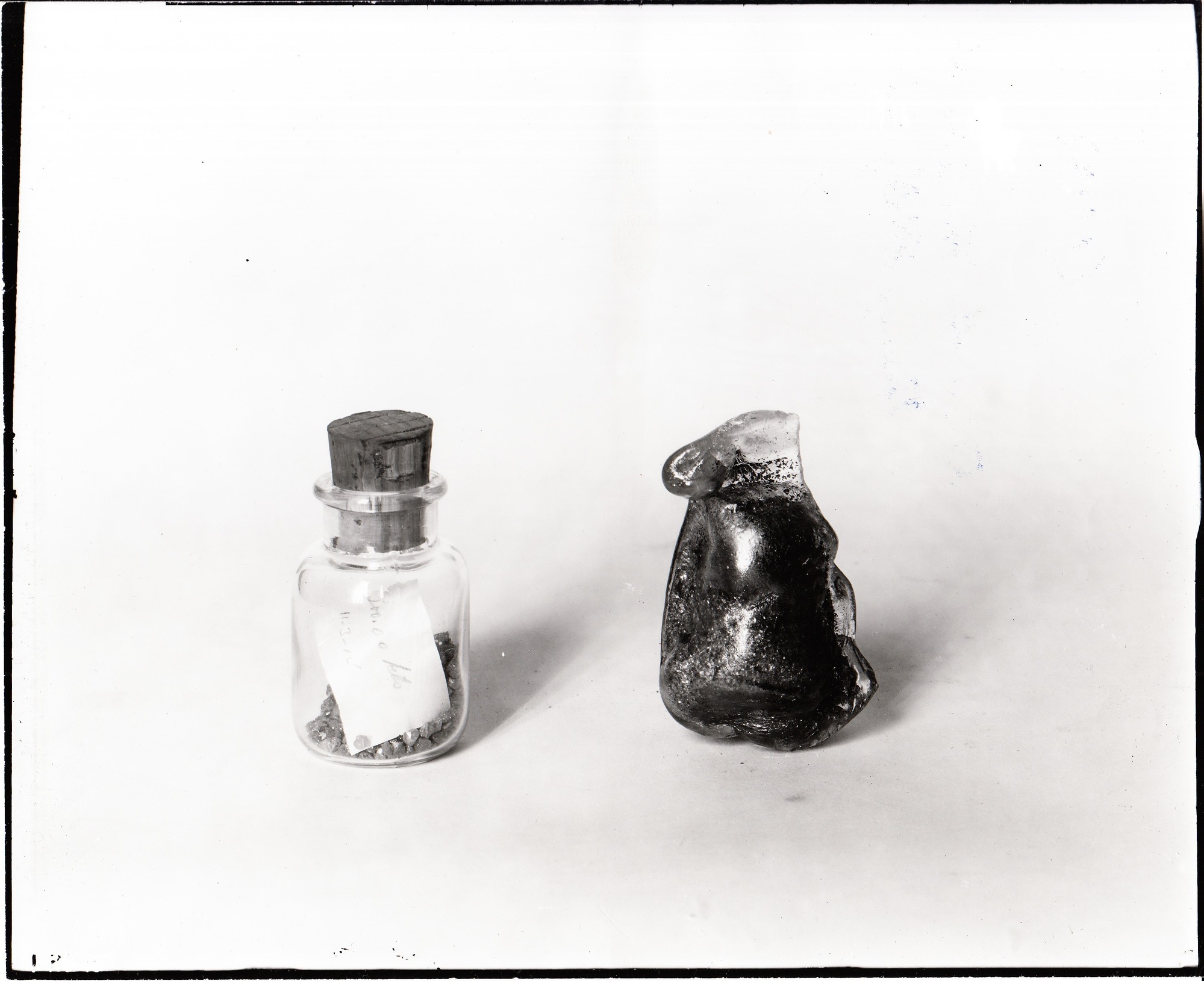 Two bottles of diamonds, one of which went through the fire.