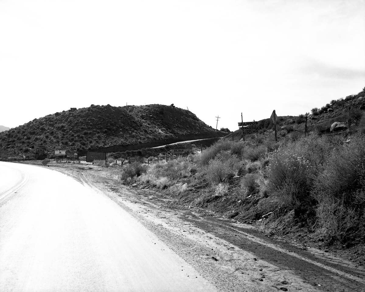 Roadside signs in Springdale on State Route 15 (now State Route 9) Grandma's signs and others just south of park entrance. For documentation of proposed clean up project of undesirable signs and debris along the main access route to Zion National Park.