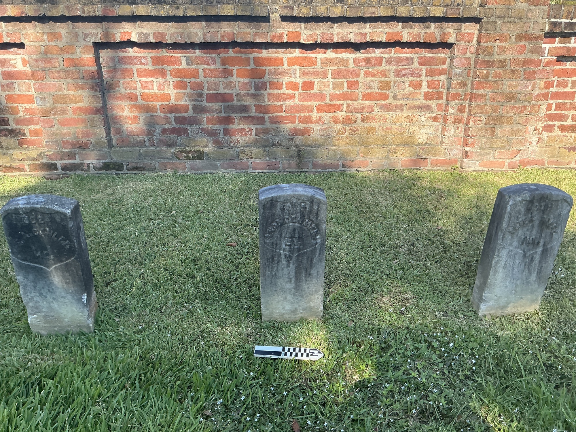 Extra image of historic upright marble headstone with recessed shield face.