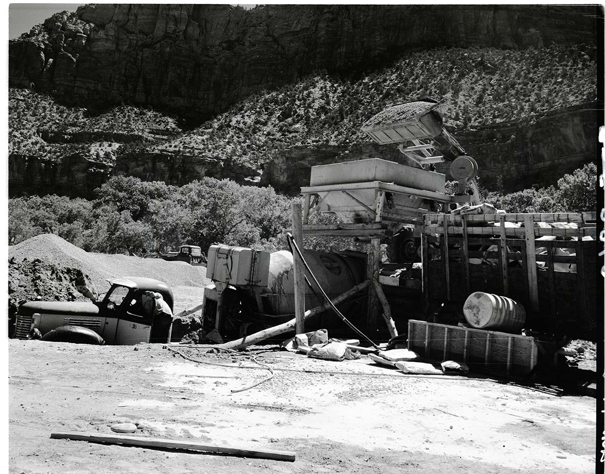 Cement mixing plant loading mixing trucks at Mission 66 Visitor Center and Museum construction.