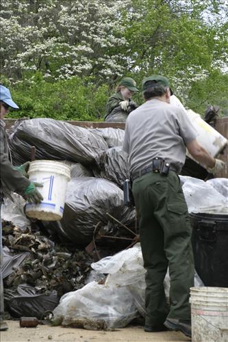 RiverDay trash clean up staff and volunteers at dumpster