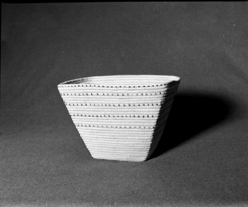 Marie Rozier Collection, Catalog No. 179. Object: Salish coiled basket. Dimensions: 11 x 12 x 9. Materials: Cedar root, cherry bark. Technology: Many split stitches, design produced by "Beading" technique. Collection History: Purchased at Vancouver Island, from a store near Duncan in 1949. Photographed by Michael Dixon, December 1982. Catalogued by Craig Bates and Barbara Beroza. Yosemite Collections, National Park Service.