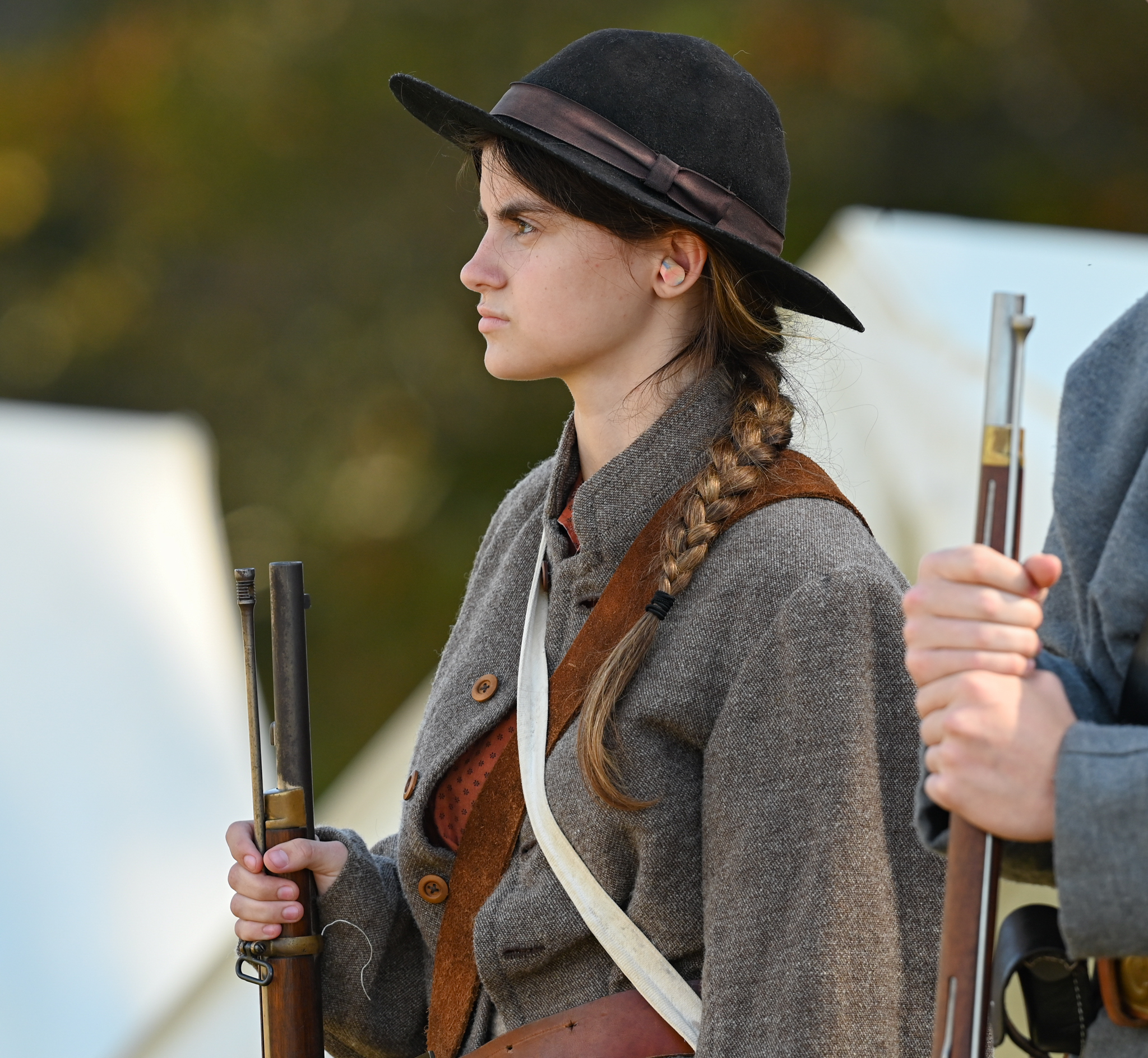 Confederate guard holding a musket.