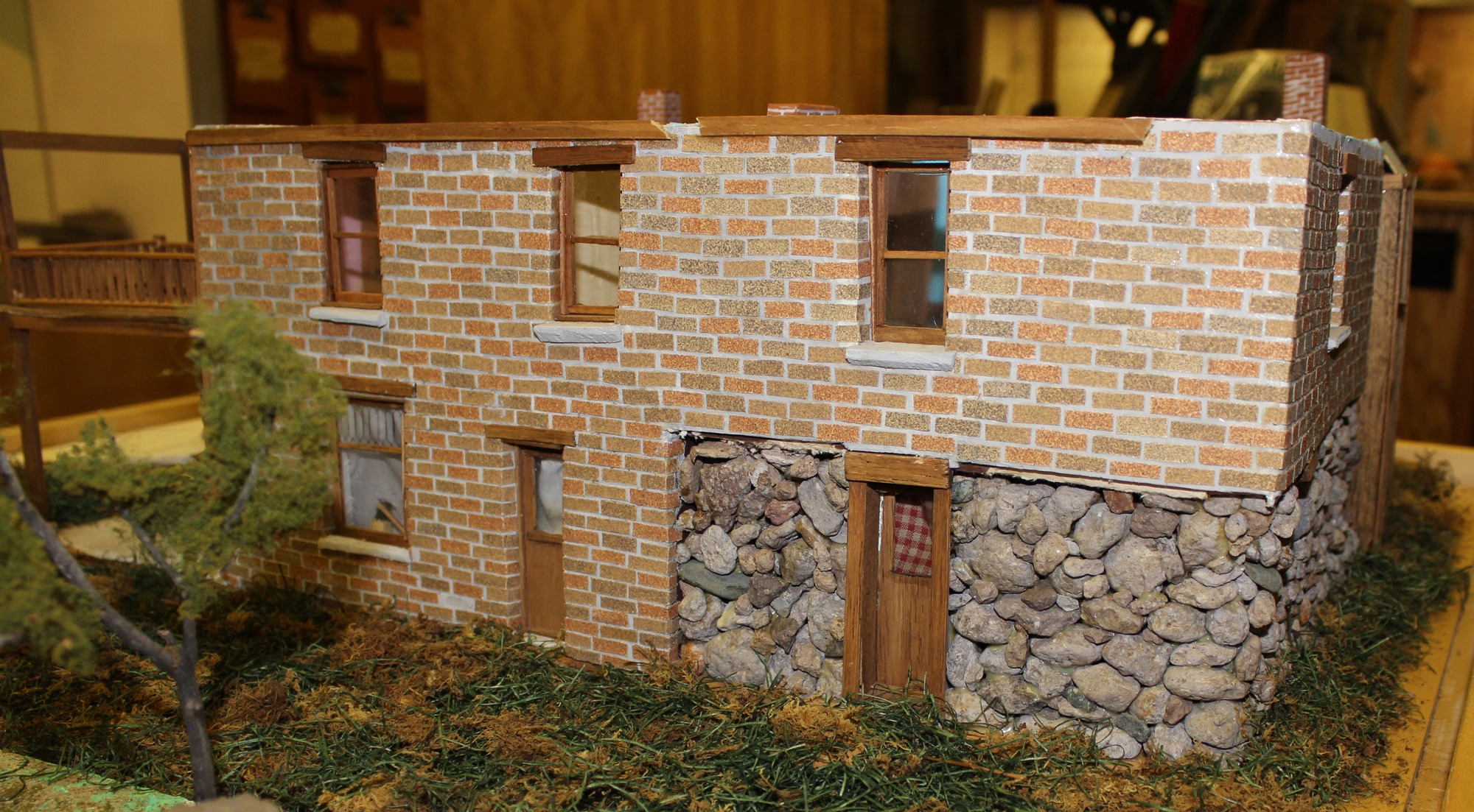 Model house of brick and stone and wood. 