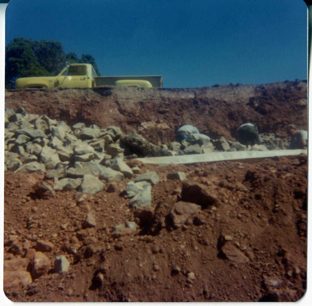 Men moving rocks during road work/repair in Kolob Canyon.