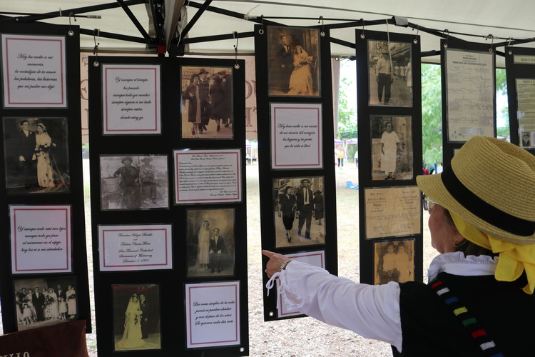 Women pointing at a photo.