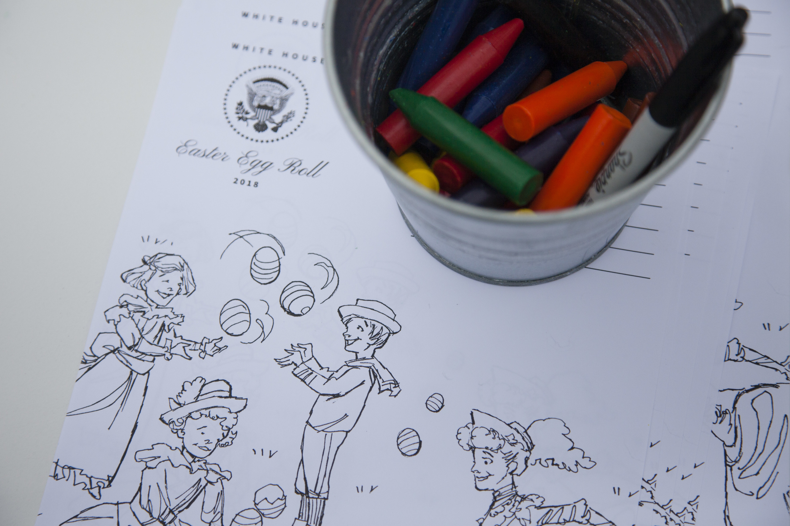 A coloring activity sheet with crayons. 