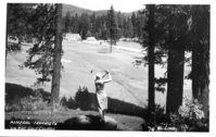 Mineral Golf Course. Henry C. Lind Historic Photographic Postcard Collection:Woman teeing off on Mineral golf course with Mineral Lodge