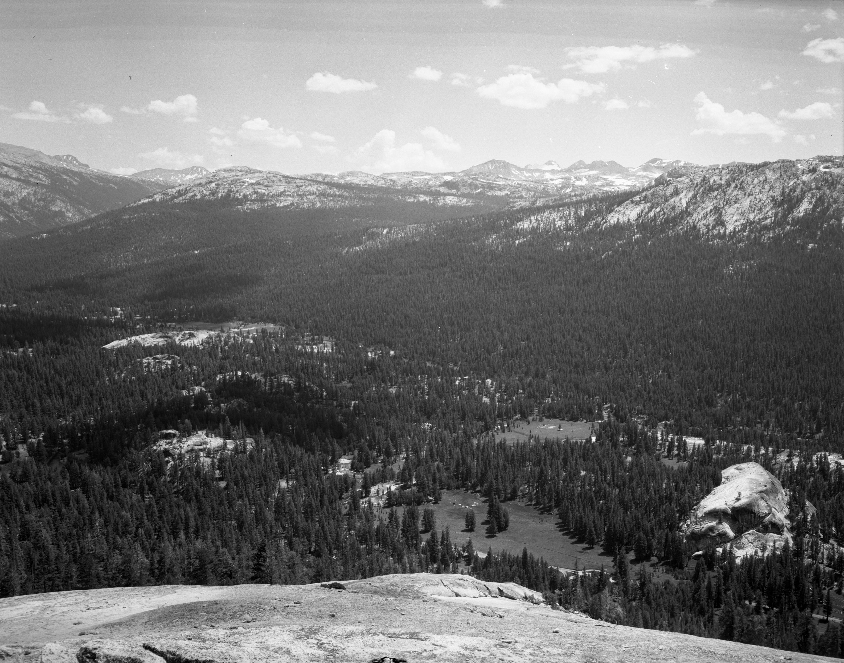 The wilderness of the Yosemite High Sierra to the southeast of Lembert Dome in Tuolumne Meadows with Mt. Lyell and Maclure in the right background.