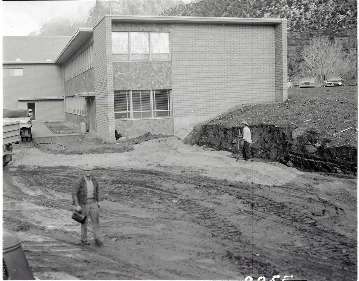 Clearing area for construction of retaining wall and parking area at rear of the Mission 66 Visitor Center and Museum.