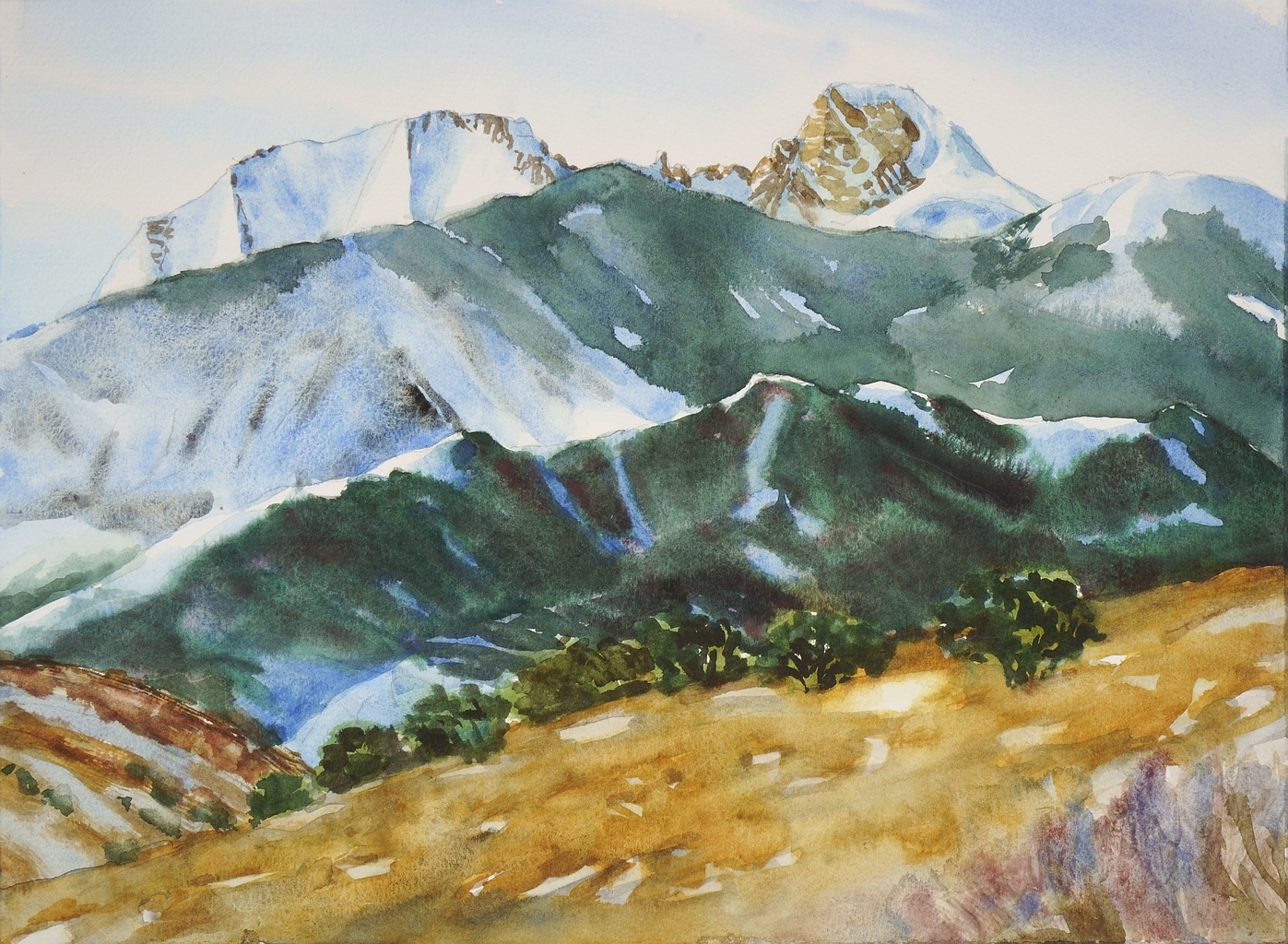 A watercolor painting of rolling mountains, fairly plainly made with only small swatches of detail. A white sky with the tiniest streaks of blue hovers above the dominating edge of the Wheeler Peak Cirque, with the sharp stone face of Wheeler Peak visible above the two groups of smaller mountains covered in green before it. The viewer stands in a tan field with some distant green trees.