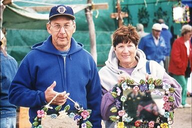 Visitors holding hand-crafted picture frames
