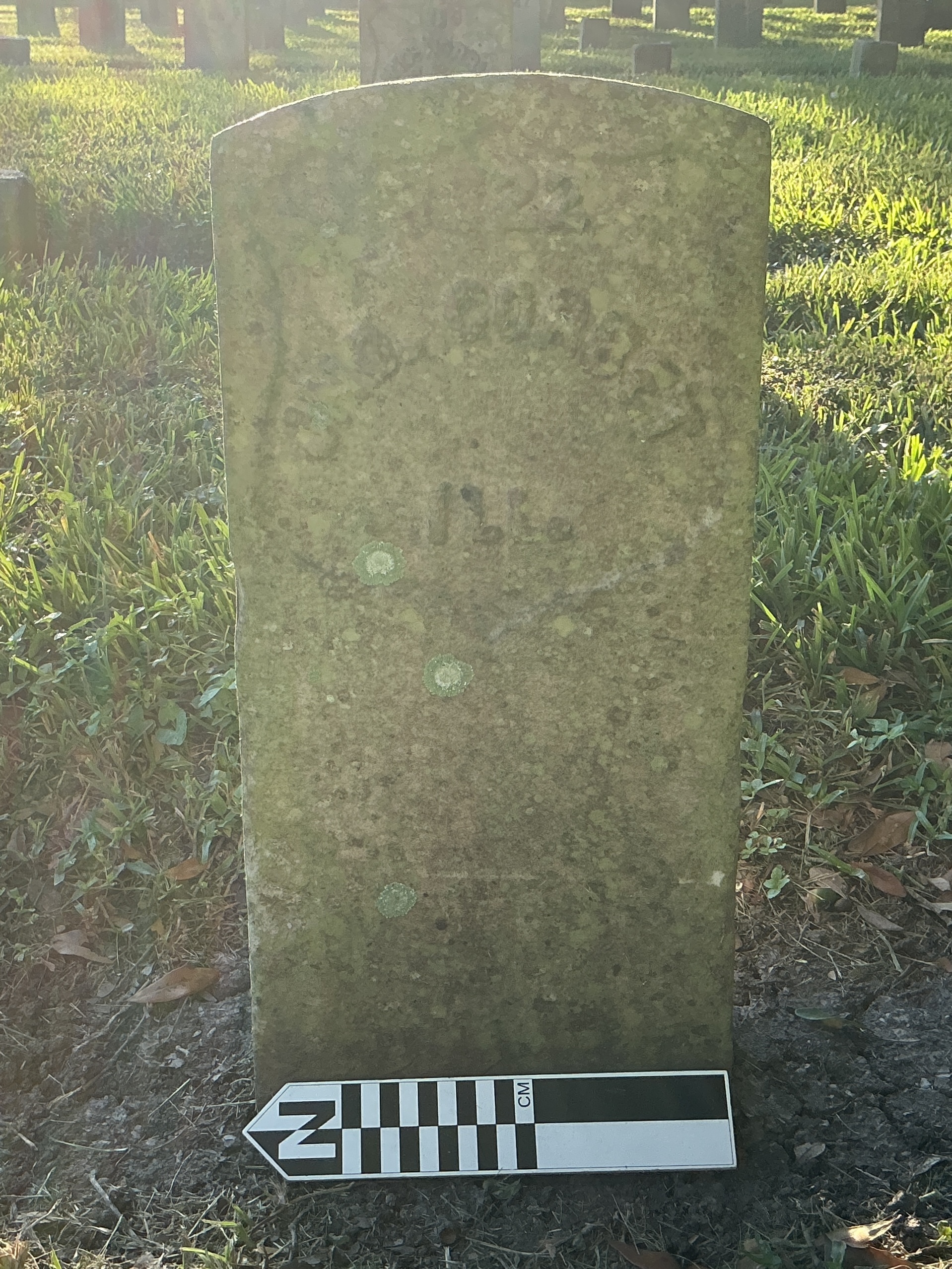 Extra image of historic upright marble headstone with recessed shield face.