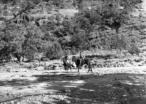 Dr. H.E. Gregory and Chief Ranger Donal Jolley on horseback in La Verkin Creek above the corral.