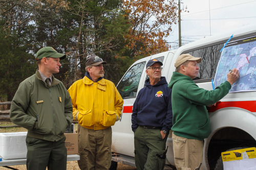 Wildland firefighters use drip torches and tools manage prescribed fire near Brawner Farm at Manassas National Battlefield Park. 