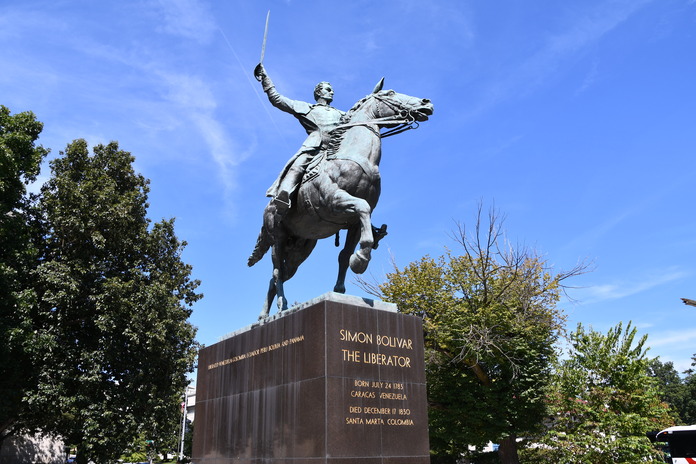 Bolivar's bronze statue sitting on top a granite pedestal 