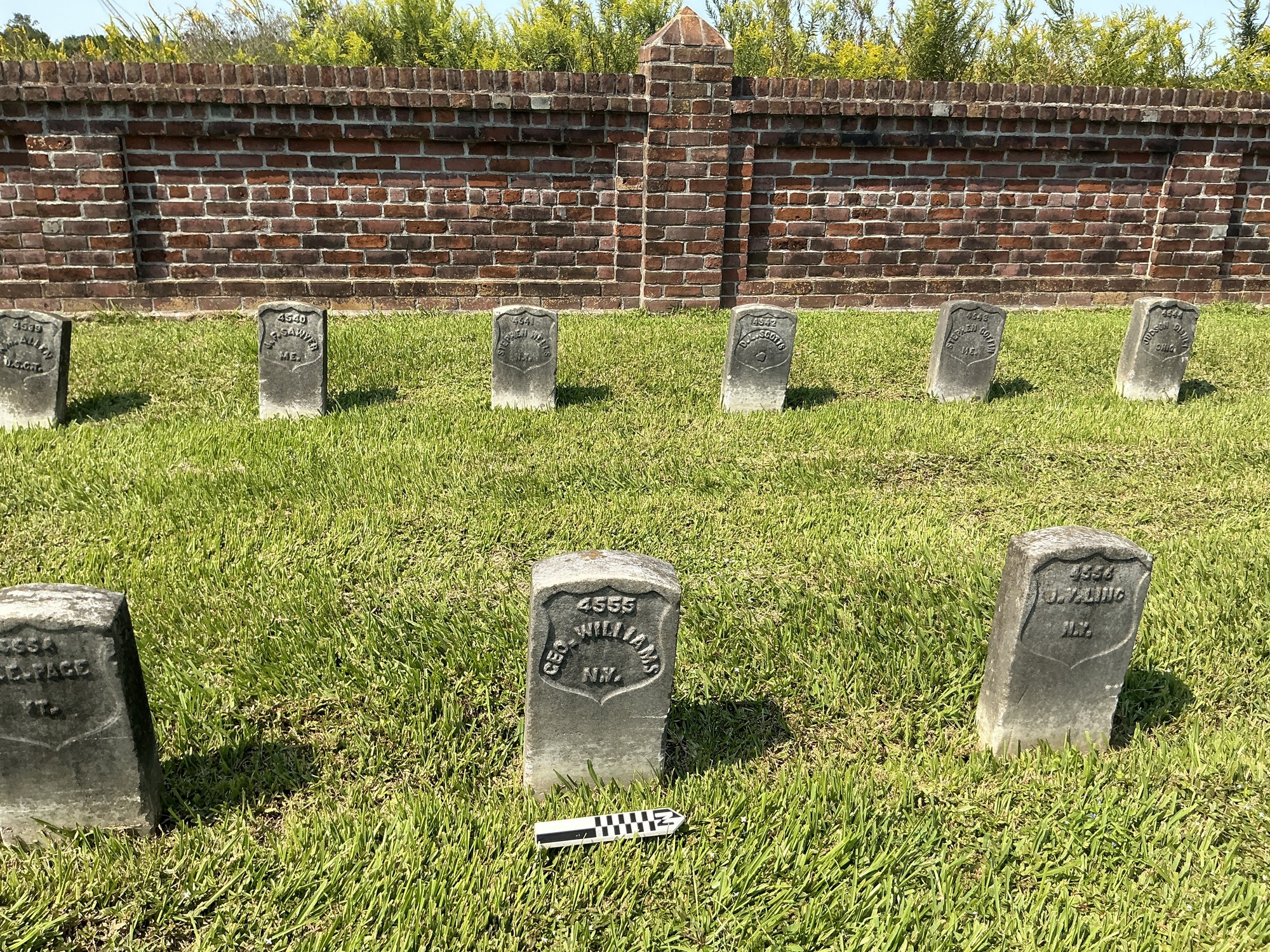 Extra image of historic upright marble headstone with recessed shield face.