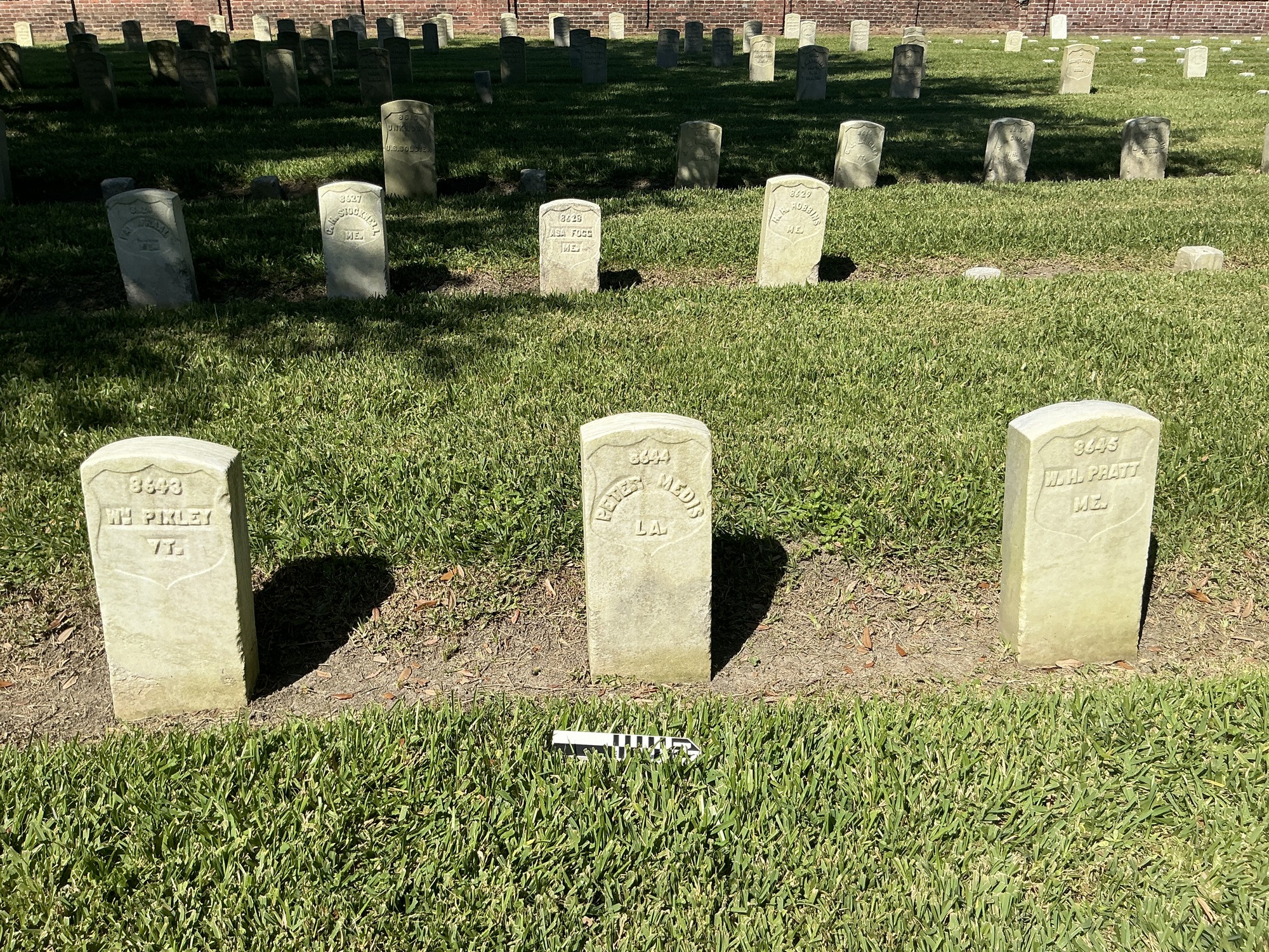 Extra image of historic upright marble headstone with recessed shield face.