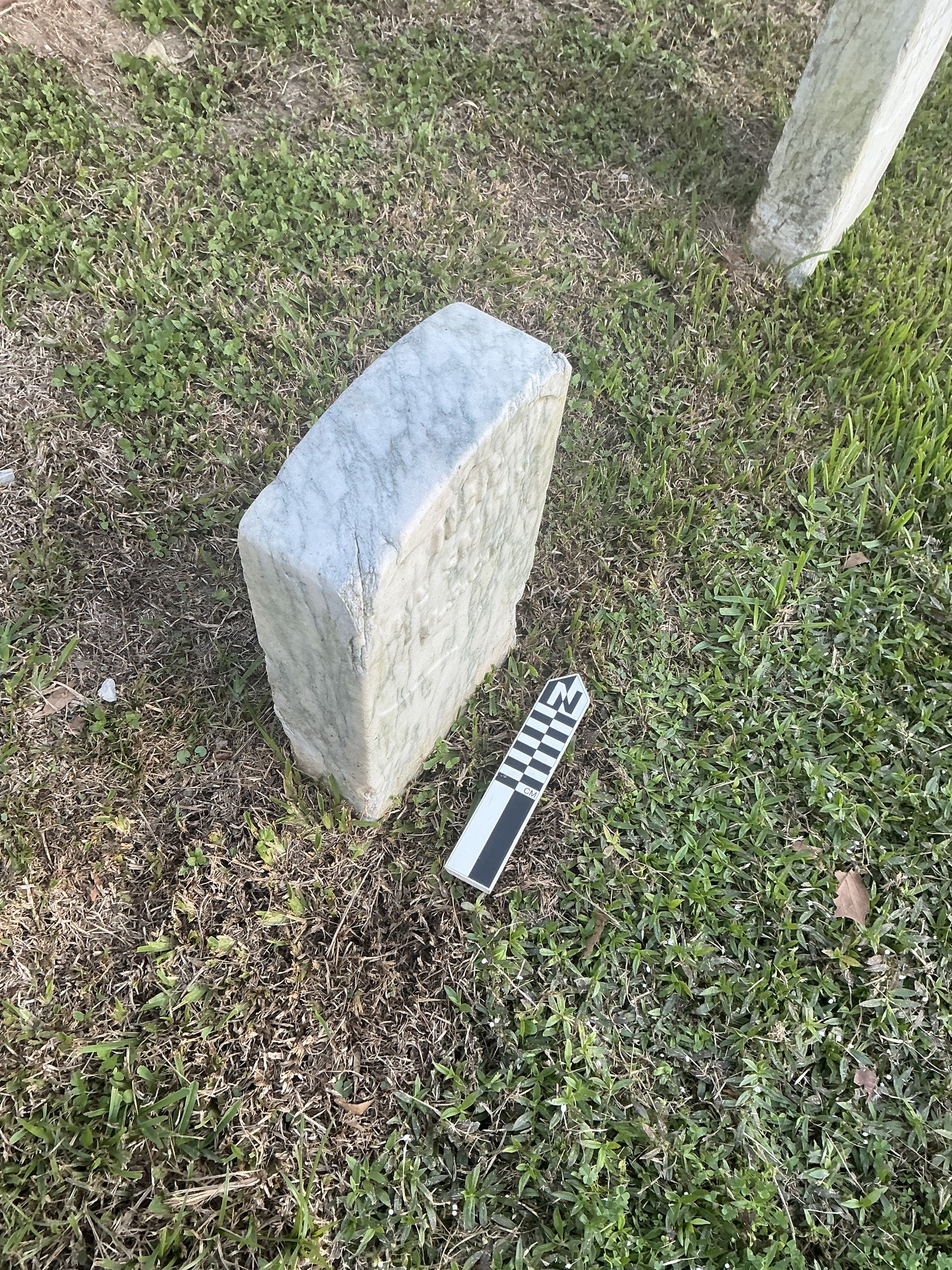 Extra image of historic upright marble headstone with recessed shield face.