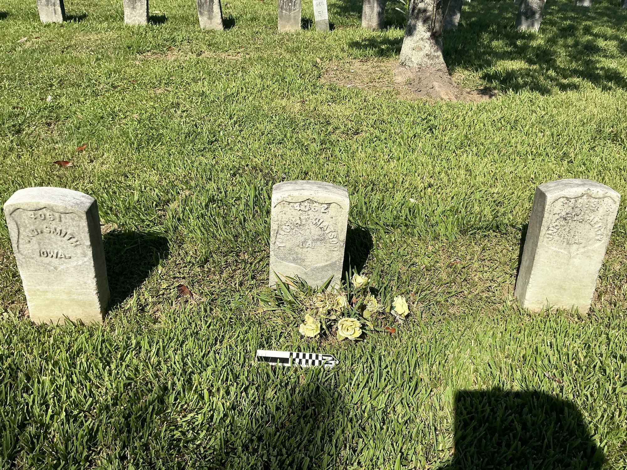 Extra image of historic upright marble headstone with recessed shield face.