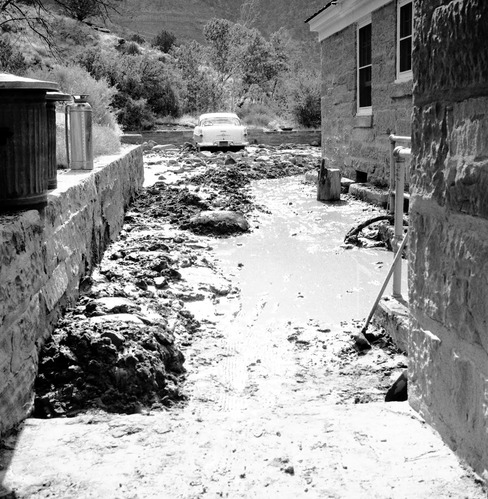 Cleanup of flood damage at ranger dorm. [One of two images on single strip of film. See also ZION 8578 frame 1.]