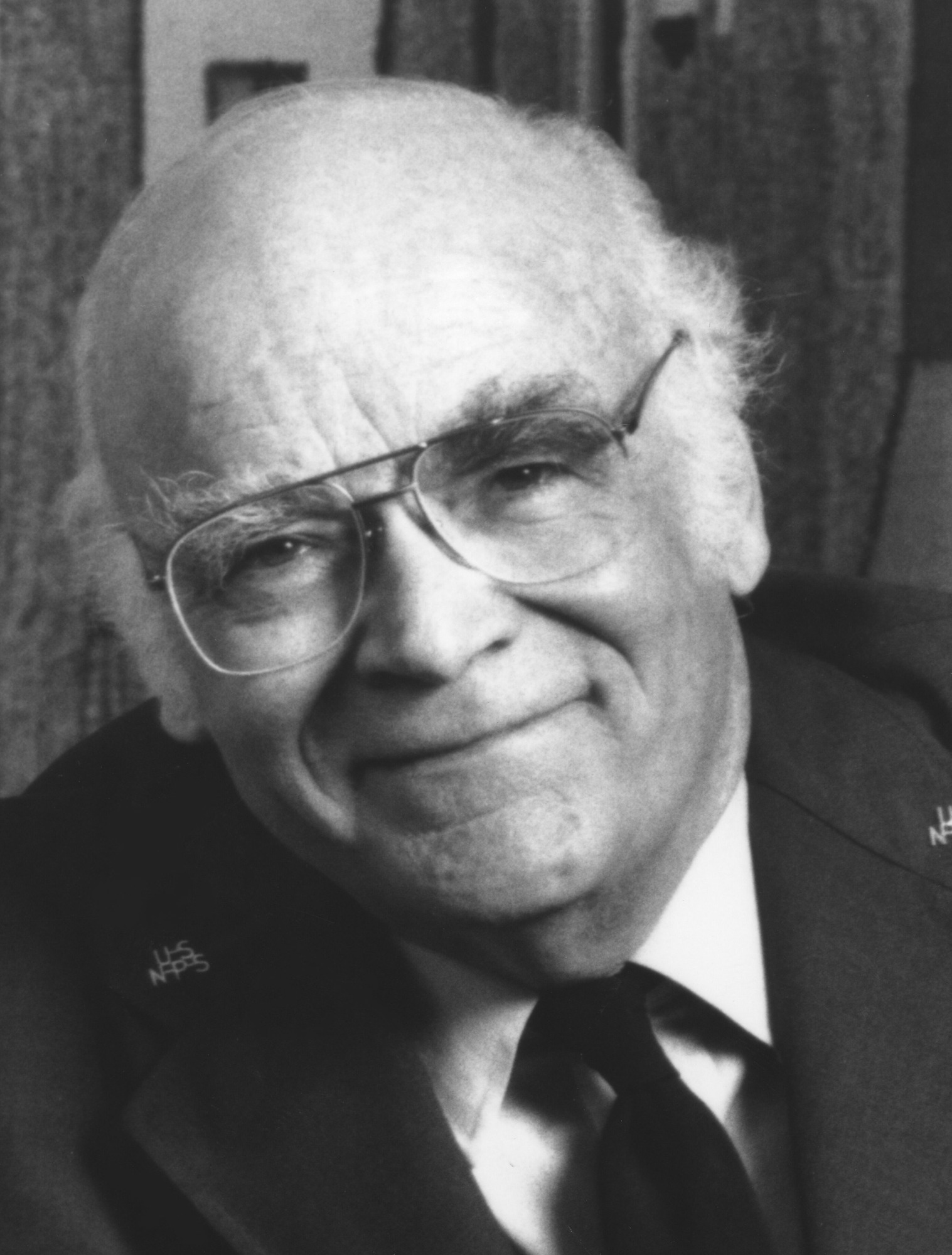 Black and white portrait of Roger Kennedy wearing his NPS uniform.
