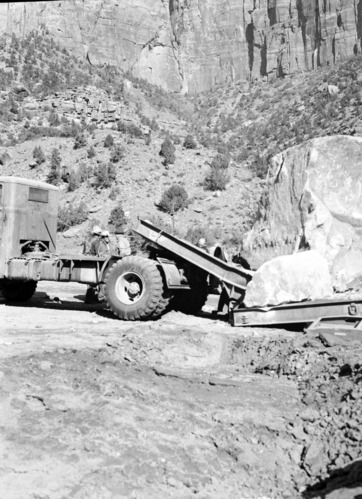 Rock fall which damaged plumber shop, Oak Creek maintenance yard. R.D. Pollock visible on hill side.