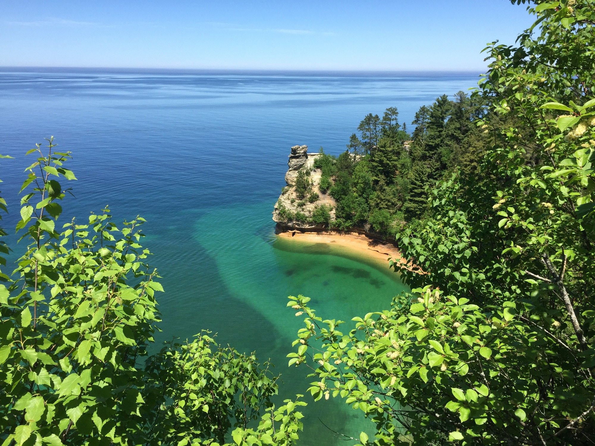 Miners Castle is a sandstone feature that reminded early European explorers of a castle. It looks like a round turret on top. It sticks out into Lake Superior.