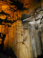 Flowstone clings to a small section of cave wall. 