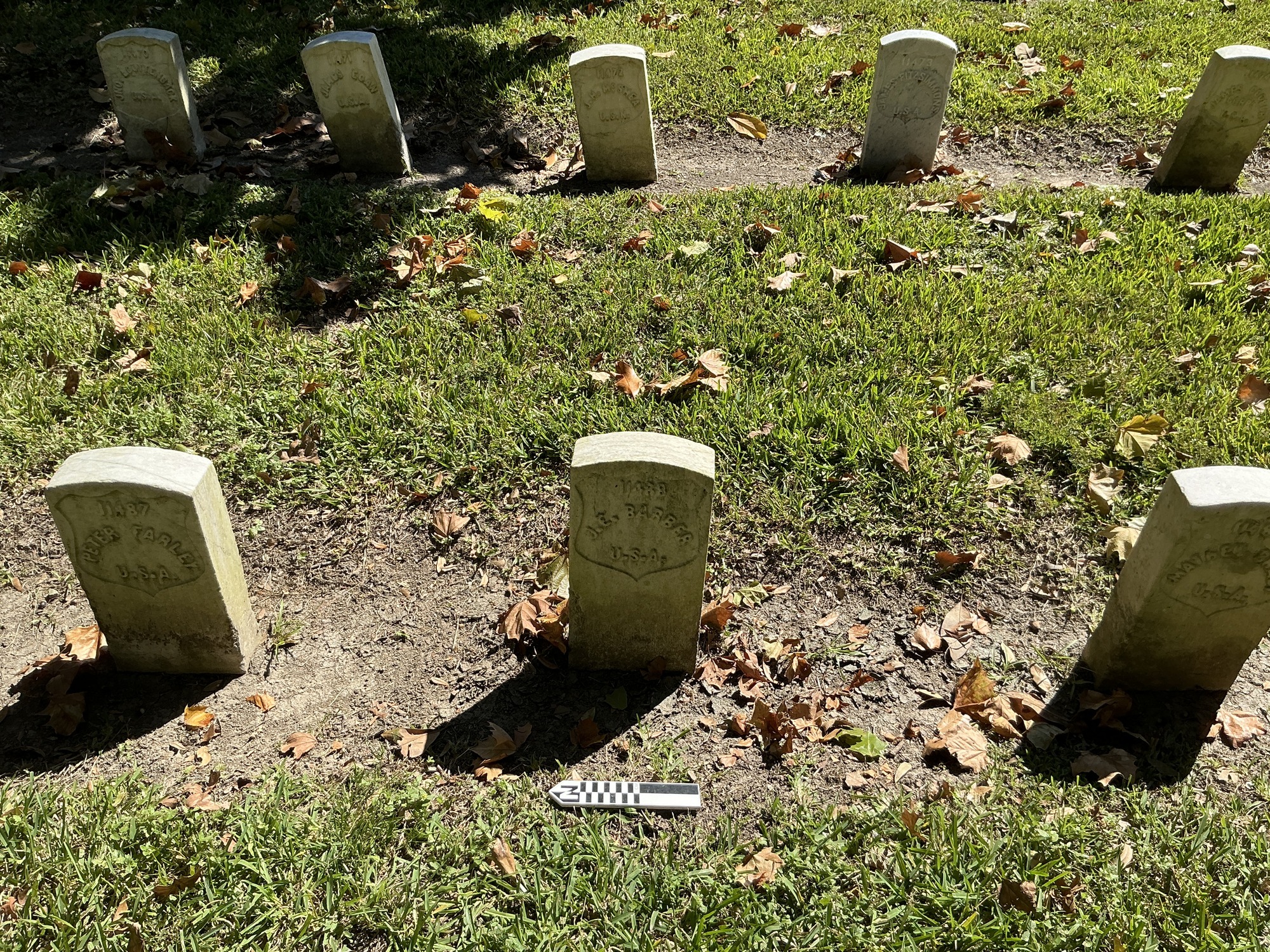 Extra image of historic upright marble headstone with recessed shield face.
