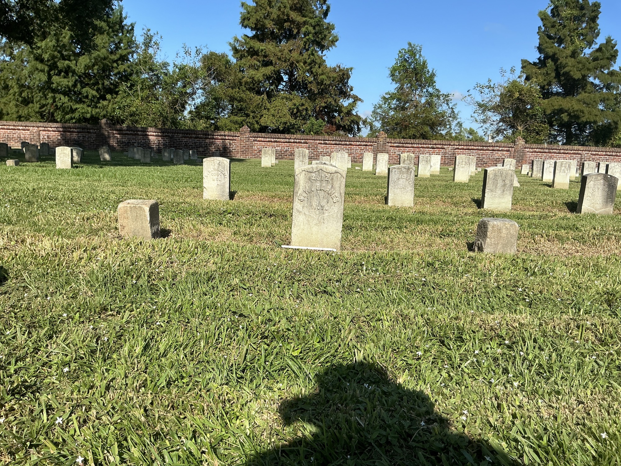 Extra image of historic upright marble headstone with recessed shield face.