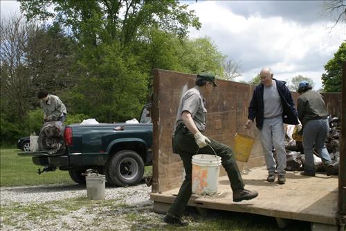 RiverDay trash clean up staff and volunteers at dumpster
