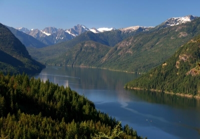 Glacier-covered peaks rise above the blue waters of Ross Lake.