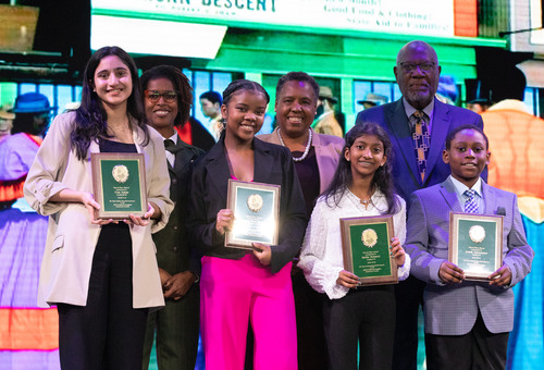 A group of students accepts awards
