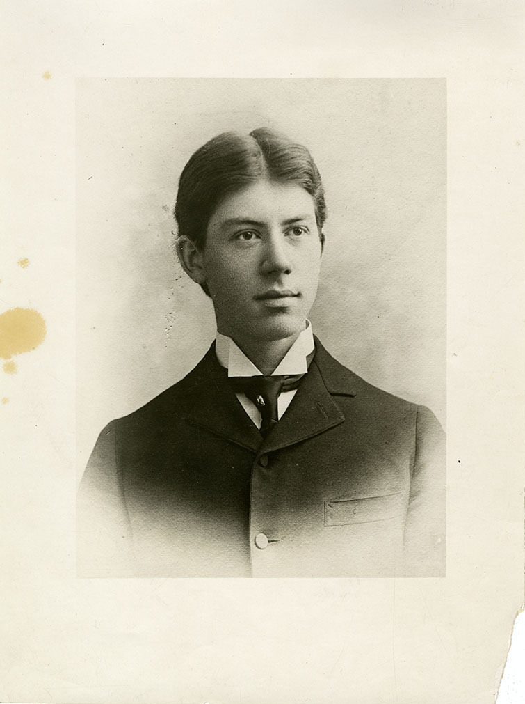 This is an historic black and white photograph from the Scotty's Castle Historic Photograph Collection, Death Valley National Park of Albert M. Johnson, formal portrait. Approximately high school age, circa 1900. Unknown photographer or studio.