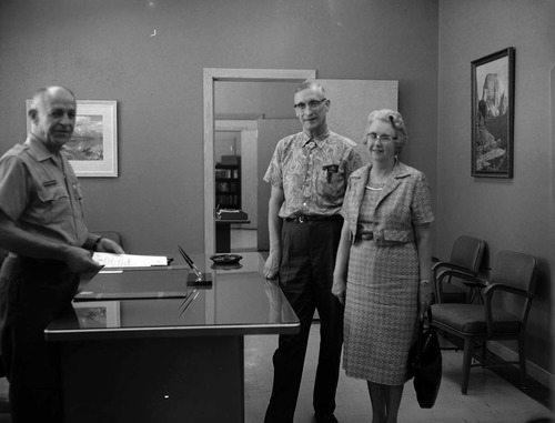 Superintendent Frank R. Oberhansley presenting certificate to Ernest and Stella Gisseman of Midvale, Utah, the Millionth Visitor to Zion National Park.