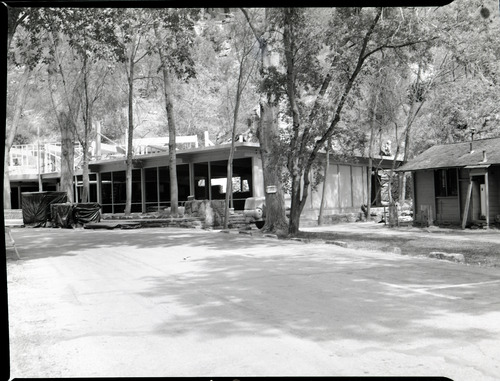 Rebuilding Zion Lodge after fire of January 28, 1966 - walls and ceilings of much of lodge in place.