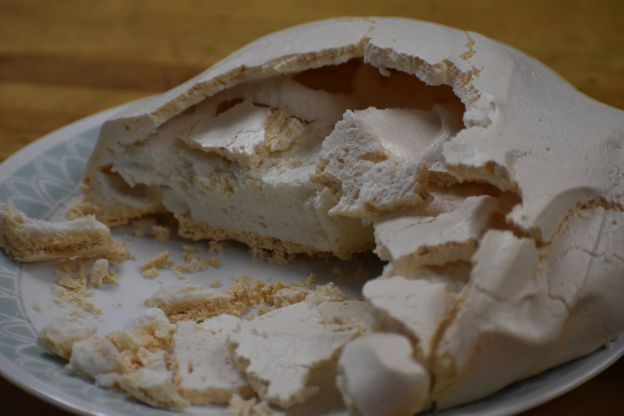 A pavlova dessert cut in half. 