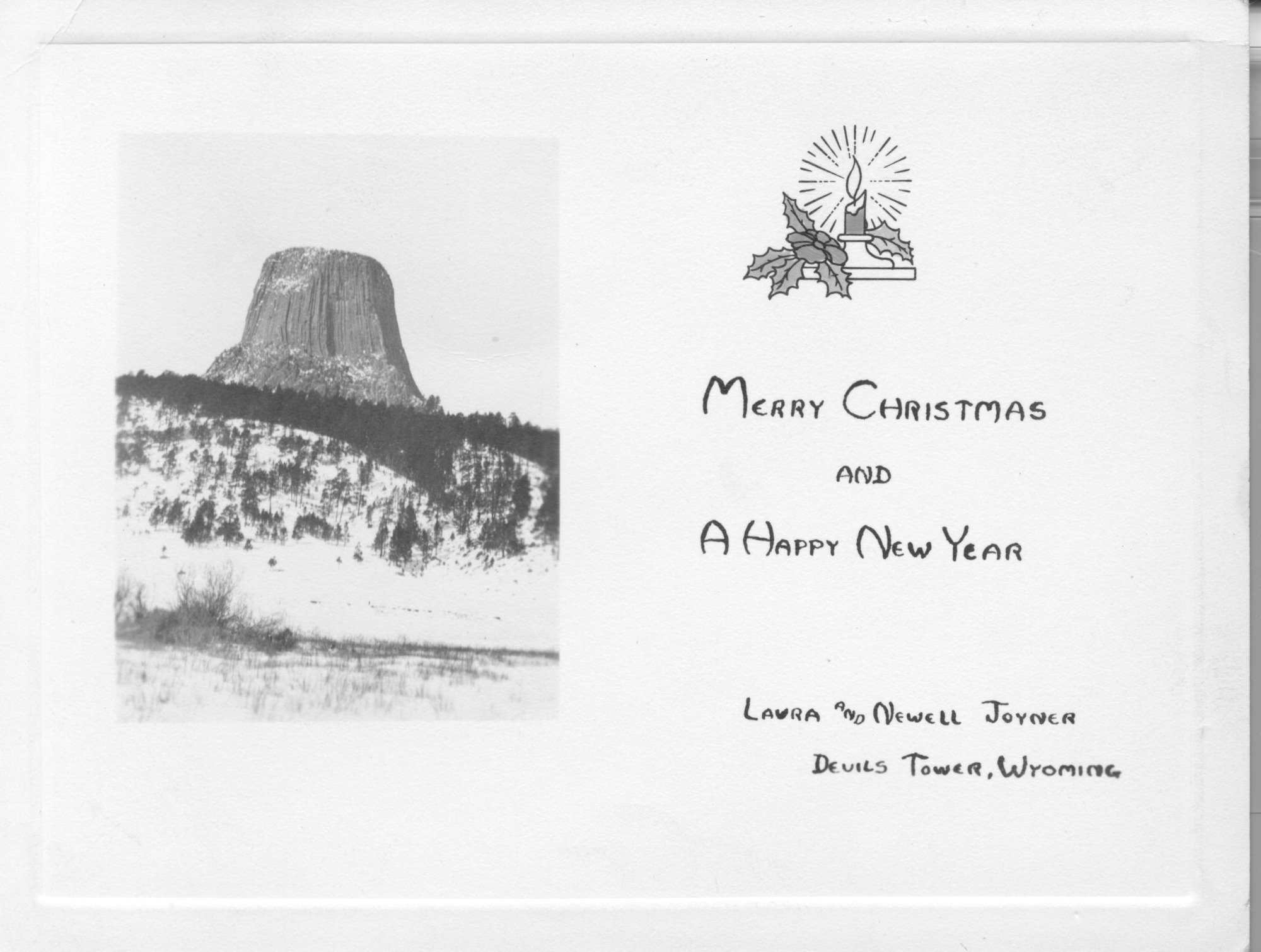 A card with a picture of Devils Tower that says "Merry Christmas and a Happy New Year."