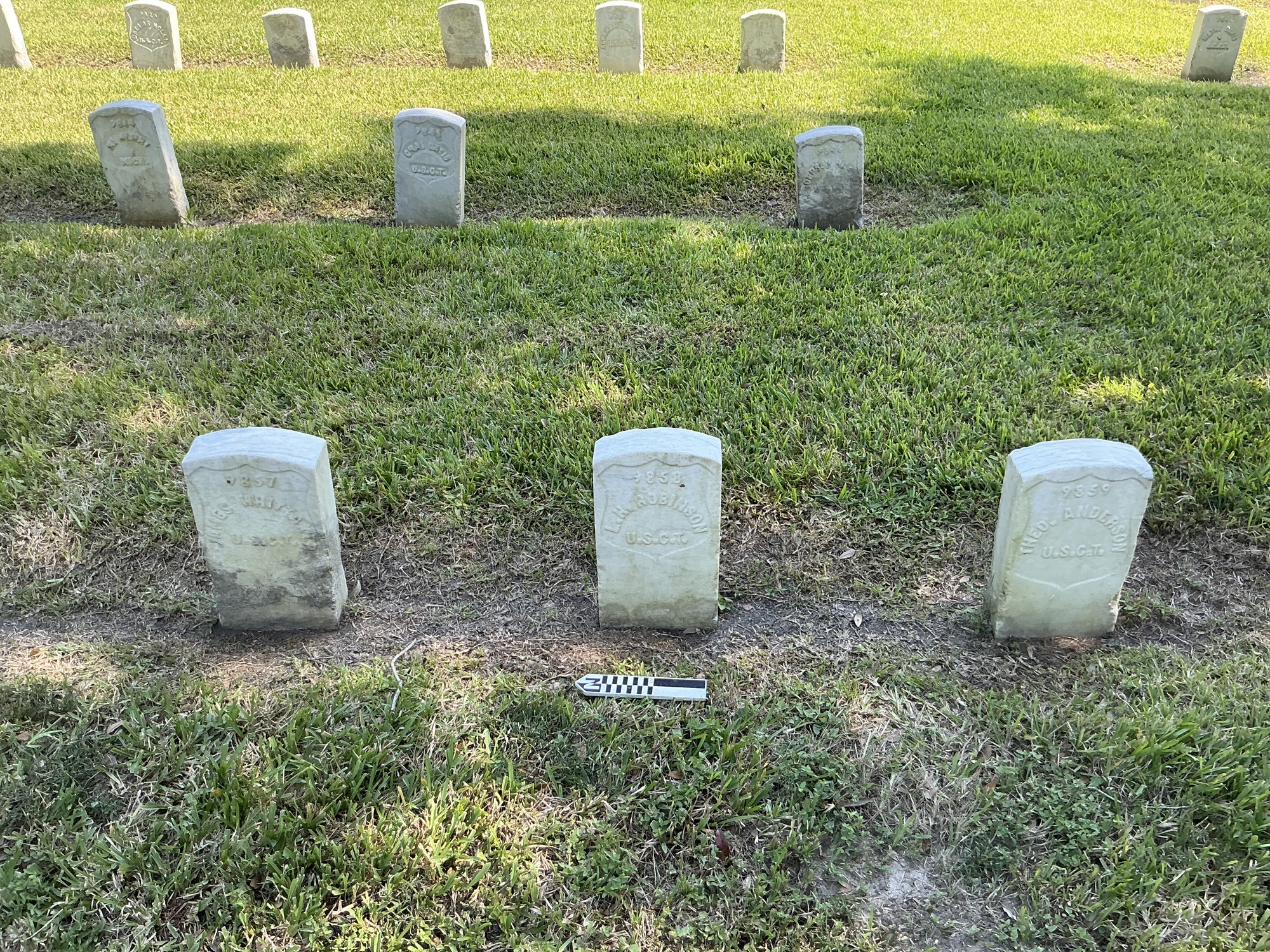 Extra image of historic upright marble headstone with recessed shield face.