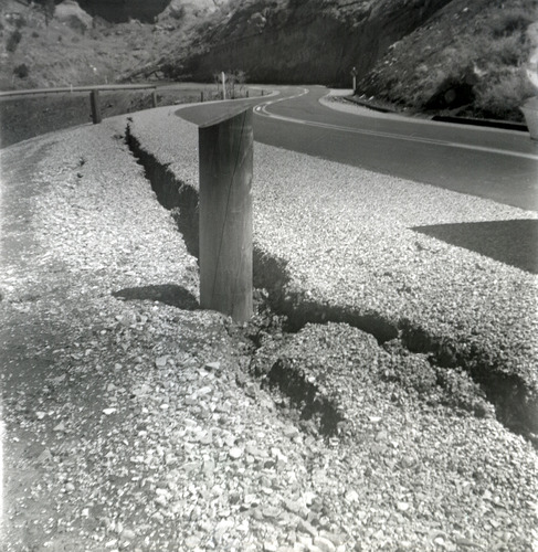 Wooden post in road crack during east side road repair and turn out construction.