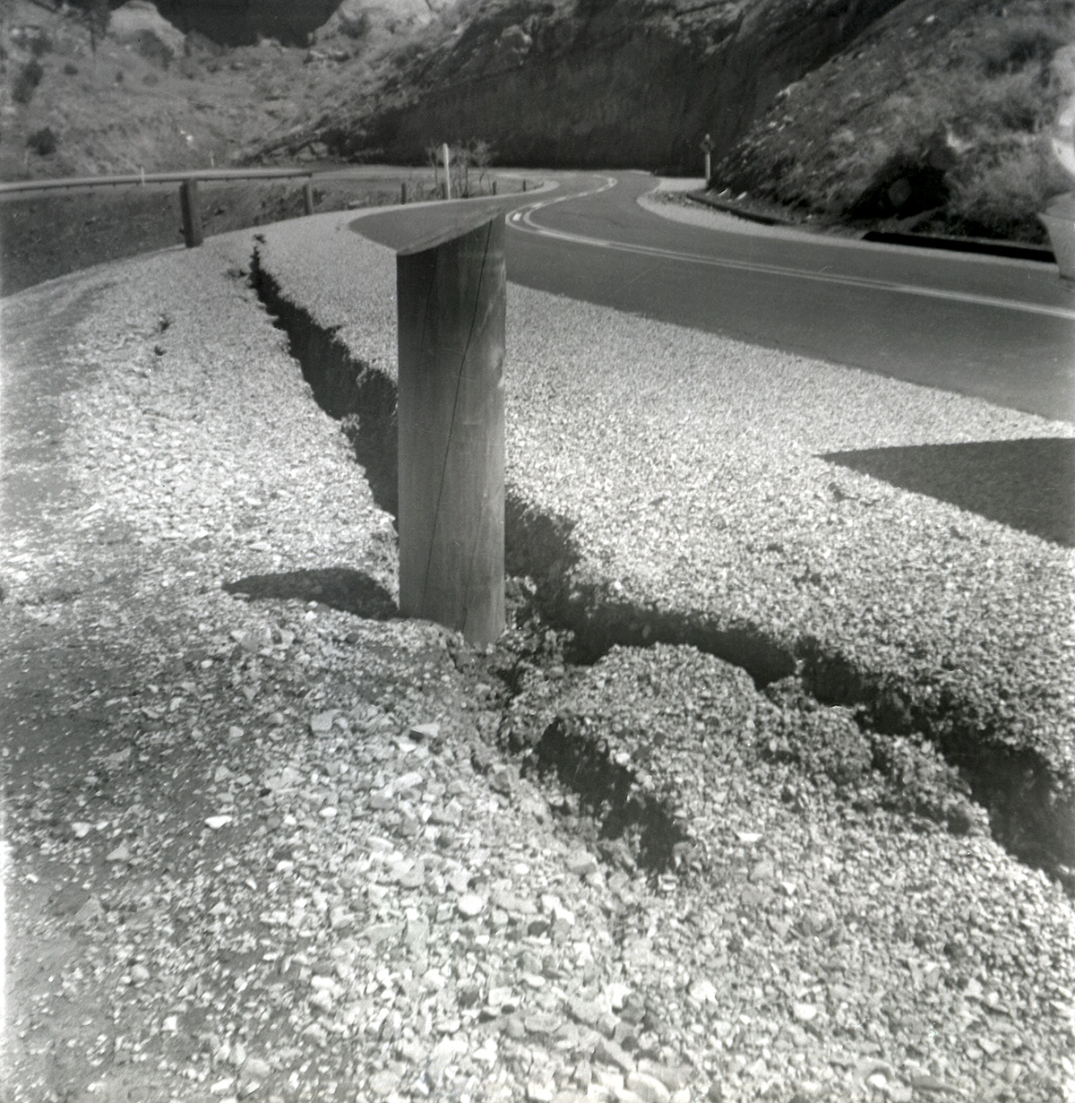 Wooden post in road crack during east side road repair and turn out construction.