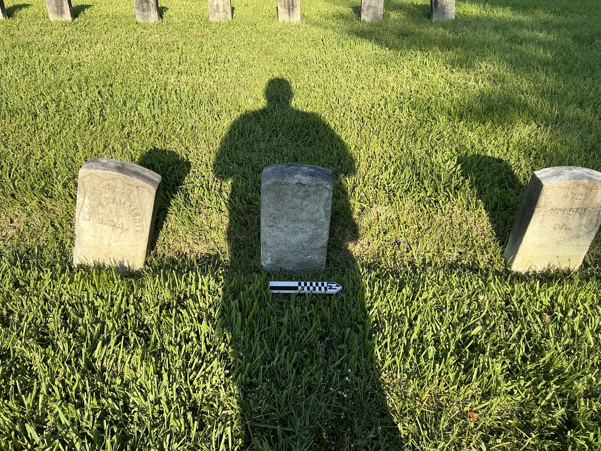Extra image of historic upright marble headstone with recessed shield face.